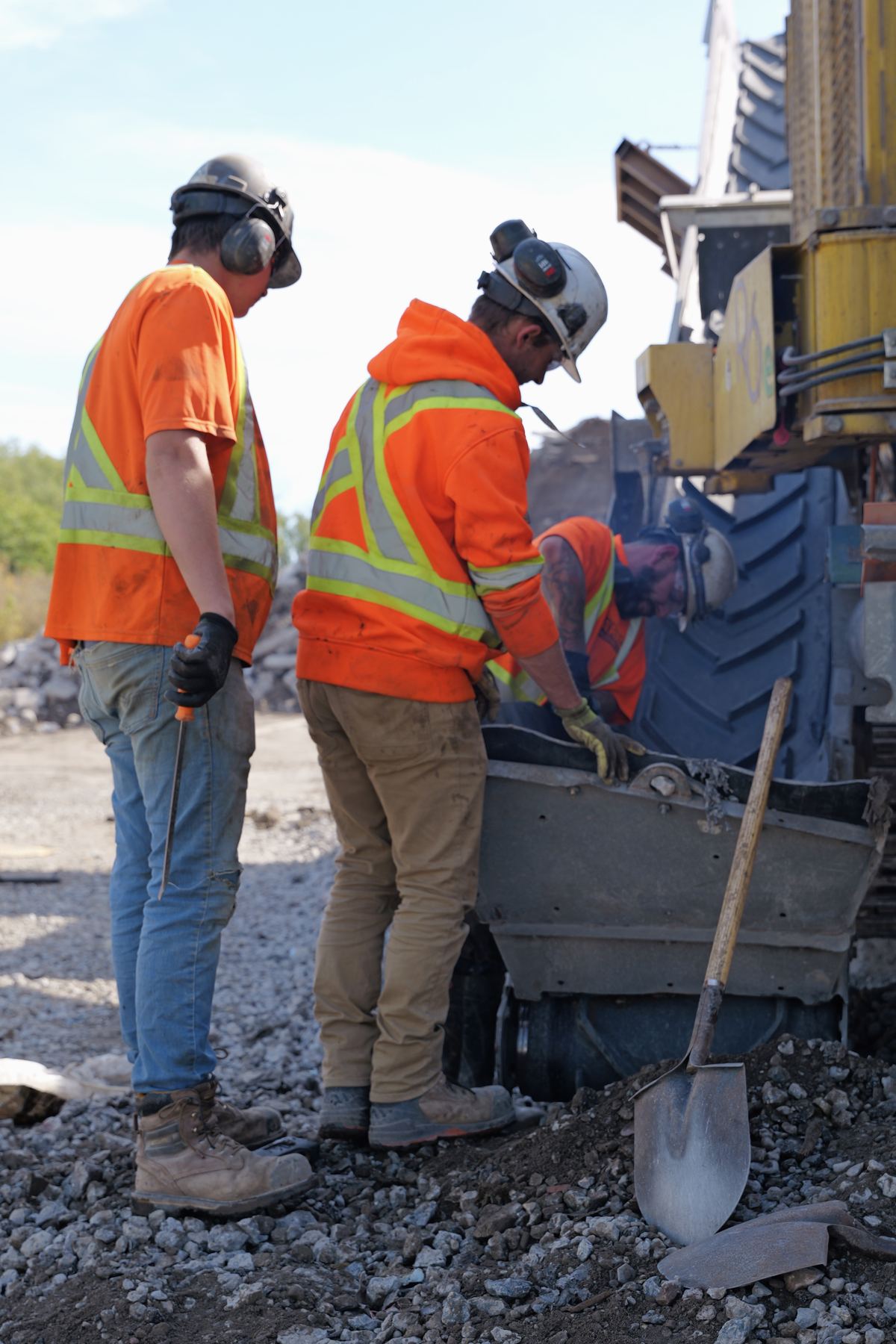 ARRO crew feeding the crusher hopper on site