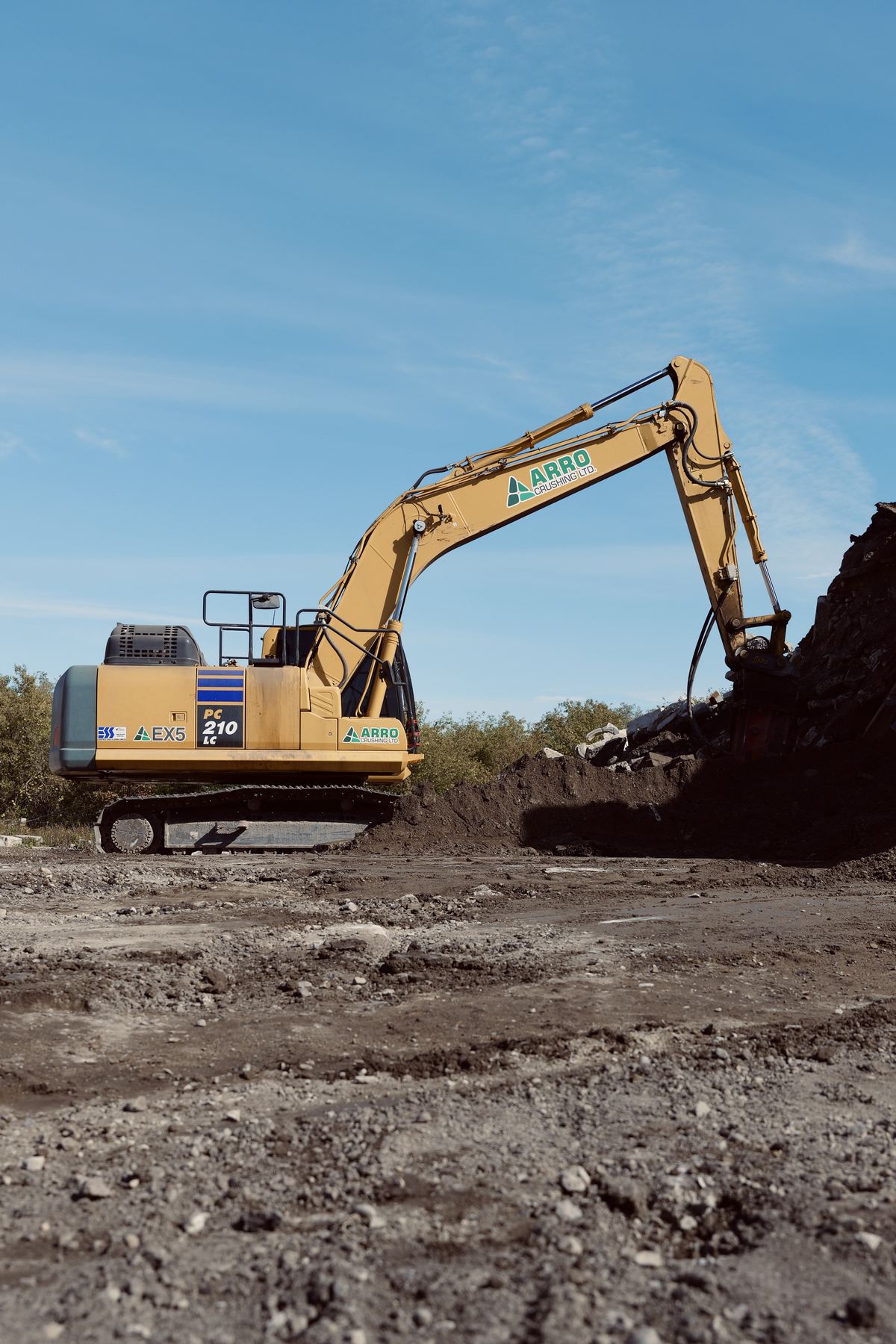 ARRO excavator working a stockpile on a construction site